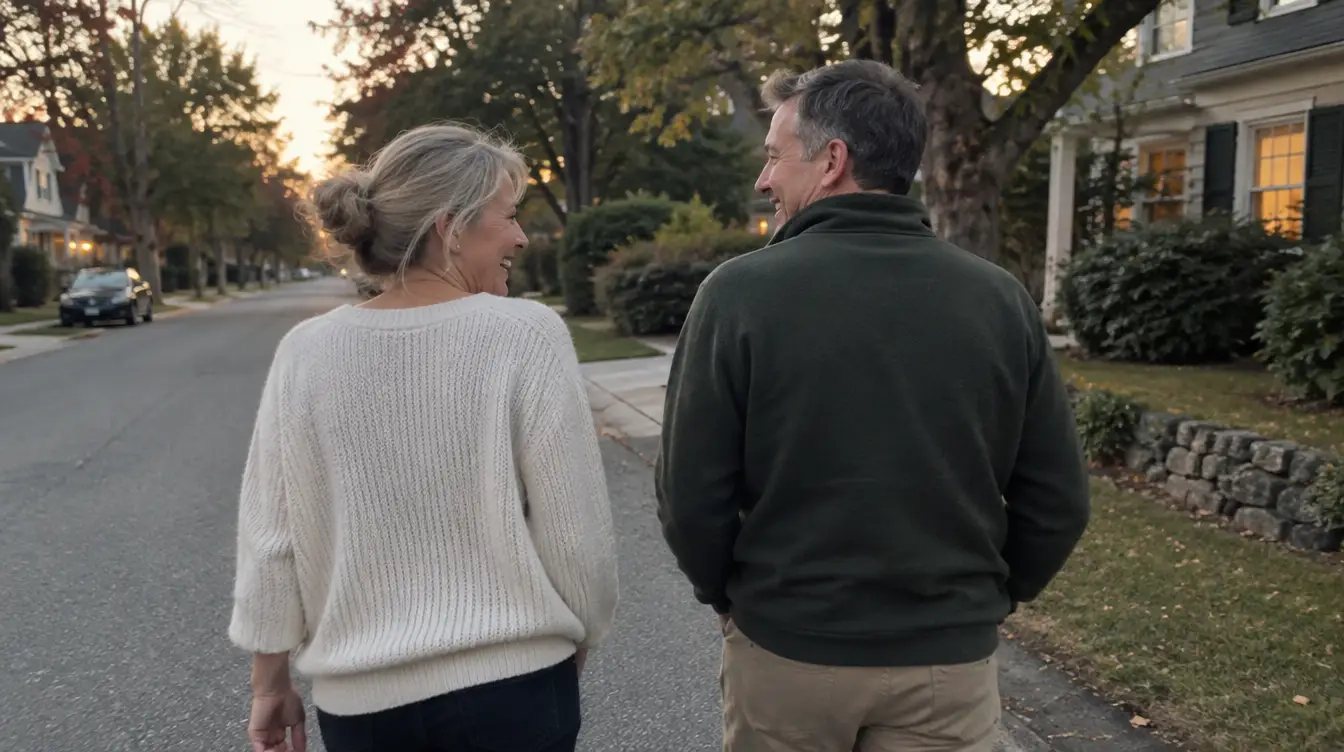 Two people walking together on a quiet road in the early evening